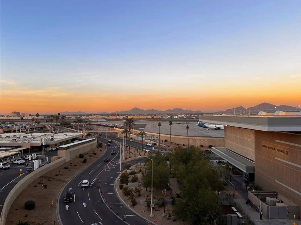 Sunset looking over the Phoenix airport and road. Mountains in the background.