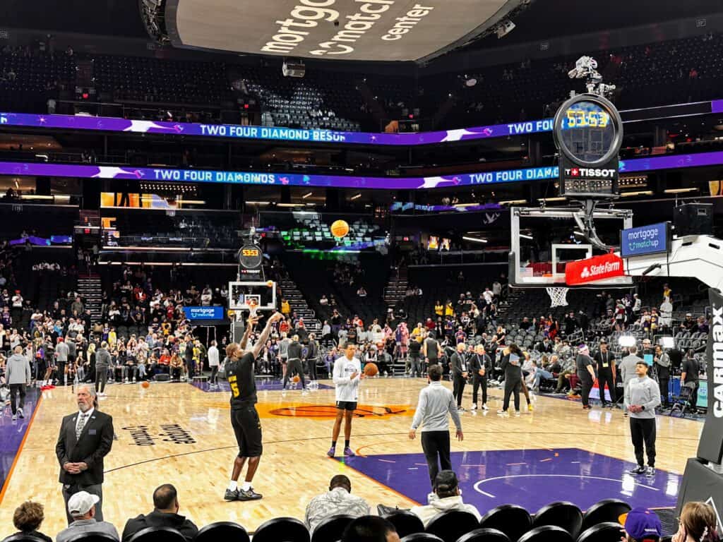 LA Lakers warmup at the Mortgage Matchup Arena in Phoenix, Arizona. Clock shows 53:53 until tipoff.