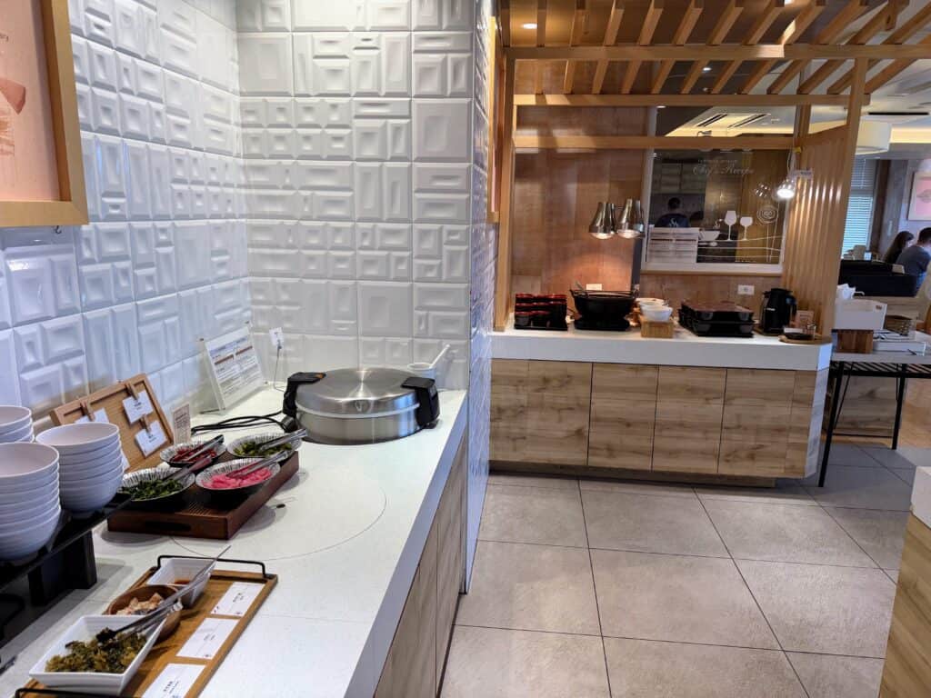 Breakfast area with hot foods at HOTEL MYSTAYS Fuji Onsen Resort.