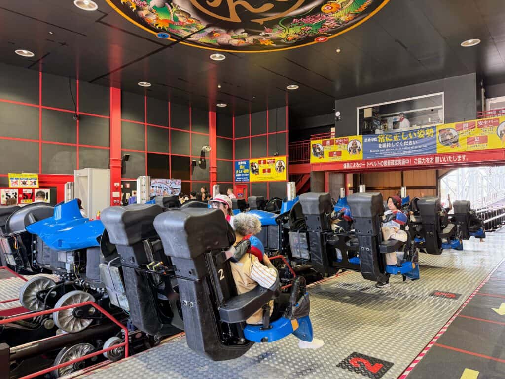 Staff does safety checks for the Eejanaika roller coaster in Japan.