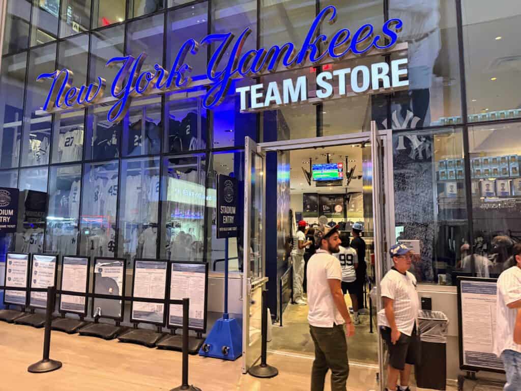 The entrance to the New York Yankees Team Store at Yankee Stadium. The walls are glass and display jerseys and other team merchandise.